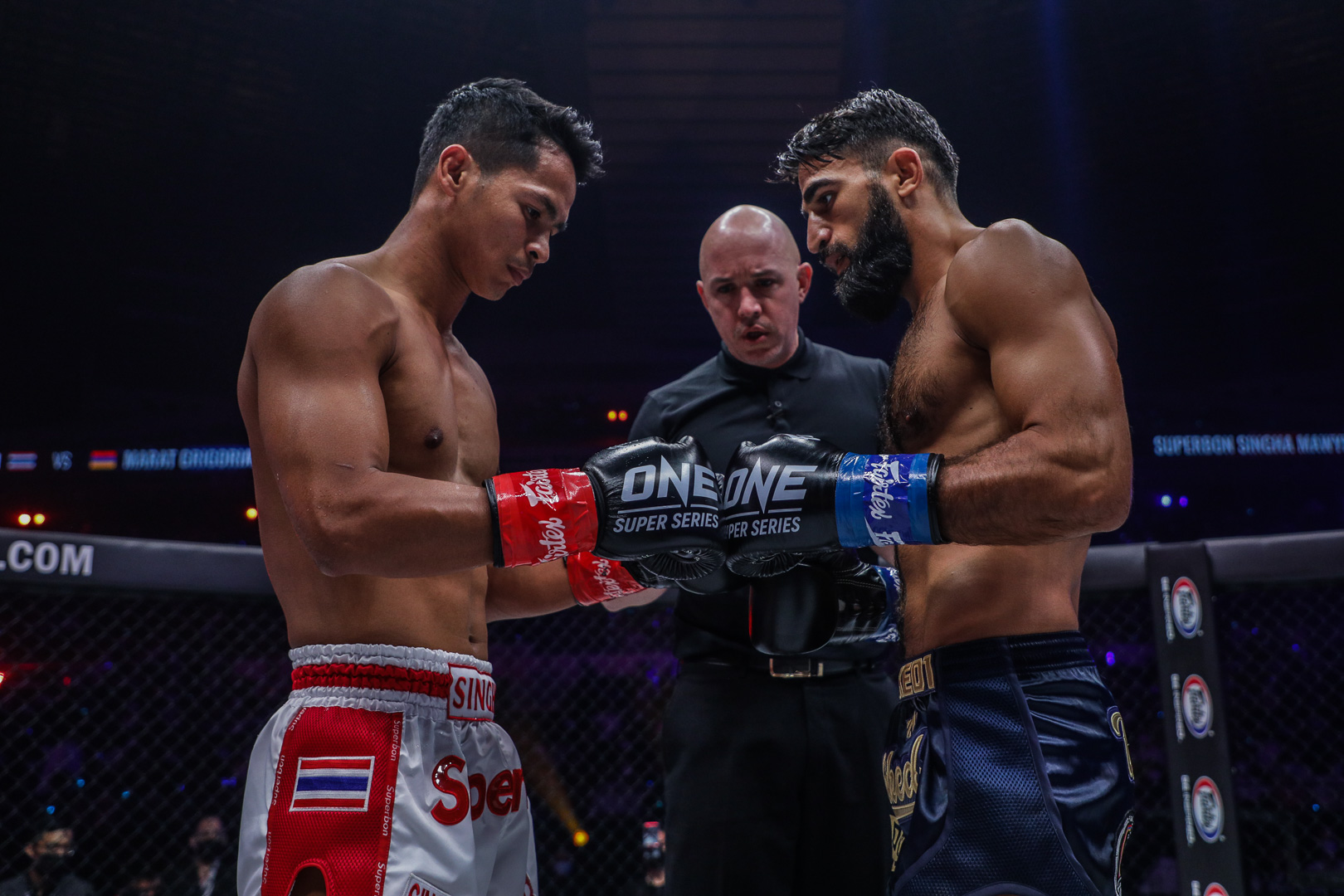 Superbon Singha Mawynn and Marat Grigorian touch gloves before their Featherweight Kickboxing World Championship fight at ONE X